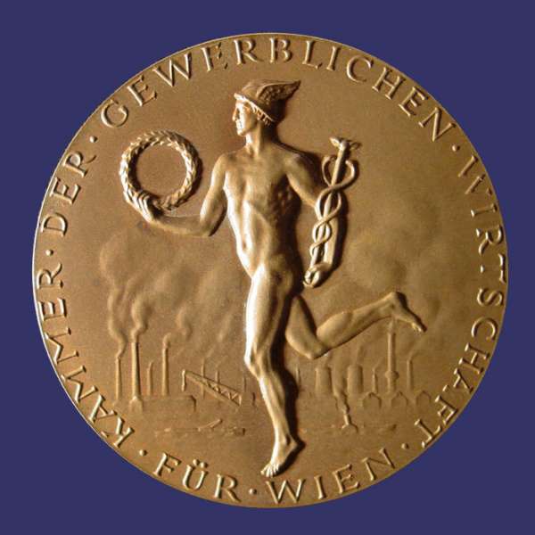 Grienauer, Edwin, Fr Treue Mitarbeit, Awarded 1965, Obverse
This medal was designed by Edwin Grienauer for the "Kammer Der Gewerblichen Wirtschaft" (Chamber of the Commercial Economy of Vienna).  Edwin Grienauer was one of the more important Viennese Sculptors and Medalist of the 20th Century.  He was born March 7th, 1893 and by 1912, at age 19, he was already creating his first portrait plaques.  His body of work spans more than half a century.  Grienauer worked almost exclusively from commission and was proficient in all areas of sculptural design.  He died on August 21st, 1964.

These medals were issued over many years, exist in different sizes and metal compositions and have individualized dedications located below the three men on the reverse.  They were awarded for lengthy terms of service.

The obverse depicts Mercury carrying  a caduceus and a wreath.  In the background are the smoke stacks of industry at a riverside (Vienna is divided by the Danube River).  Across the bottom is inscribed "Fr Wien" and around the rim, "Kammer Der Gewerblichen Wirtschaft" (Chamber of the Commercial Economy of Vienna).  The reverse depicts three men in a classical style cooperating in pulling a load.   Below the image is the inscription "Fr Treue Mitarbeit" (For Loyal Dedication) "Frau Edeltraud Knapp Wien 1965" (Mrs. Edeltraud Knapp, Vienna 1958).

The medal work of Grienauers consists mainly of commissioned pieces for his customers and this aspect of his work is dominated by award/service medals of national or economic institutions and prizes for sporting events.  His large sculptures are still present today in Vienna and include reliefs and architectural sculptures, crucifixes and religious statues on and in Viennese churches, and even floor tiles for the St Stephans Cathedral.

Works include coinage dies of the Austrian 1st and 2nd Republic, medals, sculptures, and portraits.  He designed commemorative and regular issue coins for Liechtenstein as well.  Grienauer designed the denomination side of the last of the Schilling coins of Austria, which were in circulation from 1959 to 2002.

Keywords: art_deco_page nude male birks_nude_male