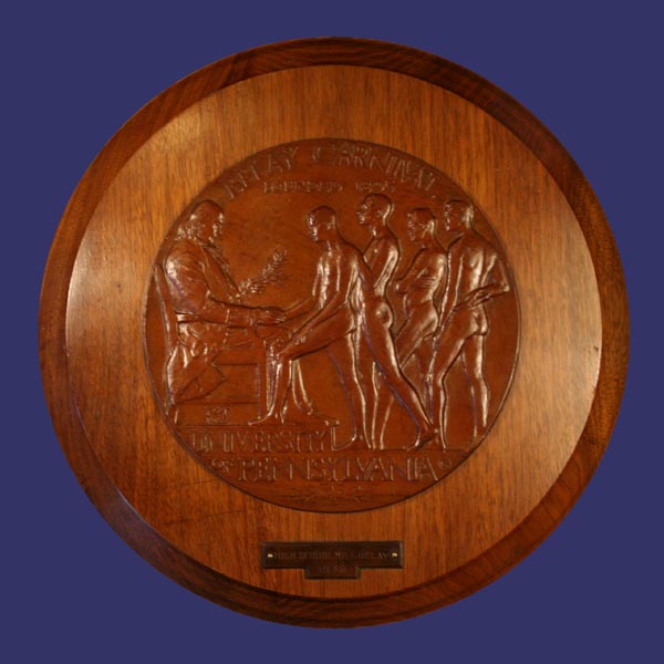 McKenzie, R. Tait, Relay Carnival, University of Pennsylvania, 1925
Bronze medal portion of plaque is 8 inch (20 cm)

Attribution:  High School Mile Relay 1938
Keywords: favorites