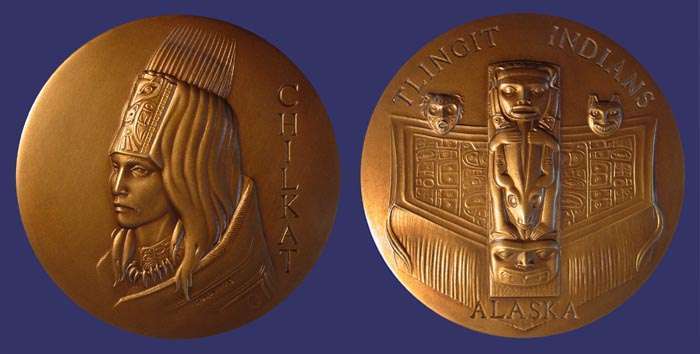 SOM#086, John Edward Svenson, Chilkat Chieftan - Tlingit Indians, Alaska, 1972
[b]From the collection of John Birks[/b]

[i]Number Issued:  1,509 Bronze[/i]

[b]FROM THE ARTIST[/b]

This medal commemorates the Chilkat Indians, members of the Tlinget tribe of Southeastern Alaska.  The Chilkat Chieftan is shown on the obverse in ceremonial headdress with a carved wooden frontispiece overlaid with ermine pelts topped with flicker feathers and walrus whiskers.  The Chilkats were noted for being the most warlike of the tribes and roamed as far south as Vancouver Island for trade and slaves.  They became affluent through fur trading with the Russians, Europeans, and Indians in the interior of Alaska.  They lived in an area of abundance and in a relatively mild climate, factors which allowed them the leisure to develop a highly sophisticated culture.  Their cultural superiority was reflected in their sense of design, artistic sensitivity and honest use of materials.  This is strongly apparent in their houae posts, carved utensils, ceremonial regalia and dance blankets.  Their culture flourished between 1850 and 1900.

Shown on the reverse side is the famous house post in Klukwan, Alaska, depicting the Strong Boy legend.  To the left is the Cannibal Mask and on the right is the Bear Dance Mask.  In the background is the Diving Whale blanket, the intricate and rare Chilkat dance blanket.

[b]ABOUT THE ARTIST[/b]

John Svenson was born in Los Angeles, California, in 1923.  After serving in World War II in Africa and Italy, he studied sculpture under Albert Stewart at the Claremont Graduate School in Claremont, California, and became personal assistant to Mr. Stewart.

He is a Fellow in the National Sculpture Society, on the Board of Trustees for Alaska Indian Arts in Port Chilkoot, Alaska, and Art Consultant to the Los Angeles County Fair Association.  He has taught sculpture in California and Alaska.

In both 1957 and 1961, Mr. Svenson received the American Institute of Architecture Award for Excellence in Sculpture.  In addition, he has been awarded numerous prizes in shows over the past twenty years.  His work has been shown in galleries throughout the United States.  He has been commissioned to create more than fifty architectural sculptures for major businesses, parks, malls, and churches, and has several hundred smaller sculptures in private collections.

John Svenson lives with his family in a new home and studio in Green Valley Lake high in the San Bernardino Mountains of Southern California.

Keywords: sold