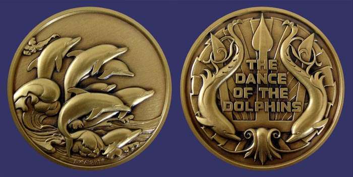 SOM#106, Don Everhart II, Dance of Dolphins, 1982
[b]From the collection of John Birks[/b]

[i]Numbers Issued:  750 Bronze[/i]

[b]FROM THE ARTIST[/b]

The theme of the dolphin as a design element on medals is not new.  The idea of stamping metal pellets with a design originated in Ionian Greece about 600 B.C. and soon after, dolphins appeared on coins.

Man has long admired these sleek sea creatures for their streamlined form and alert presence.  Like man, the dolphin is a mammal and possesses a high intelligence and a certain indescribable zest for life.

To anyone who has ever been at sea, there can be no greater thrill than to suddenly be surrounded by a school of exuberant, playing dolphins. We delight as their rolling forms mimic those of the ocean they so harmoniously live in.

Perhaps someday we will communicate with the dolphin on a higher level than thought possible.  Maybe then we will learn what they obviously already know; that life is to be enjoyed and celebrated, and that we can live in harmony in our environment.

[b]ABOUT THE ARTIST[/b]

Don Everhart was born in York, Pennsylvania, and attended Kutztown State College where he obtained a B.F.A. in painting.  Along with various other collectibles, he has created over five hundred coins since he began his sculpture career.  He has produced coin-of-the-realm for such countries as the Philippines, Panama, and many other Central American and Caribbean countries.  Don worked at The Franklin Mint for seven years before leaving to pursue a free-lance career in 1980.

He is also an accomplished painter and has had several one-man shows along with numerous group shows in the New York-Philadelphia area.

Don's love for the ocean has led him to fish collecting and scuba diving and he has become an expert on Caribbean reef fishes.  His other interests include guitar playing and photography.

Keywords: SOM