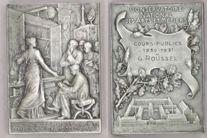 Arts et Mtiers
Silvered bronze medal ("bronze" and cornucopia struck on lower edge) 4.8x6.8 cm, female figure (doubtless the nymph Euresis) shows cabinet of inventions to students and faculty with motto "Principia invenit - describit machinas - artes demonstrat - docet omnes"(discovers principles, sets out devices, shows how the arts are used, teaches everyone), signature A. Patey in upper left corner on obverse, reverse with legend "Conservatoire National des Arts et Mtier" and aerial view of the school. Originally a commemorative medal for the hundredth anniversary of the school's existence (http://numismatics.org/collection/1940.100.2434, viewable at http://mismuseos.net/comunidad/museos/recurso/Medalla-conmemorativa-del-centenario-del-Conservat/55e40c74-433e-4620-a83e-e1006fe223db on 10th February 2014 and also on this site, search "Patey"), the reverse was later adapted by addition of a name panel. This medal was awarded to G. Roussel (conceivably Gaston Roussel (1877 - 1947), founder of Laboratoires Roussel) and is dated 1930-1931 for participation in public classes.
Keywords: Roussel